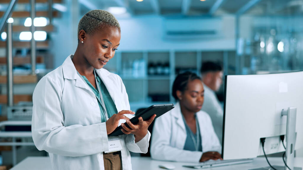Technicians inputting information into their LIMS software - Best LIMS of 2025